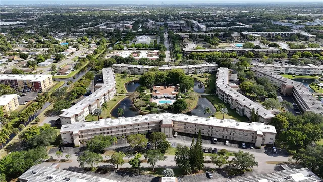 an aerial view of a houses with yard