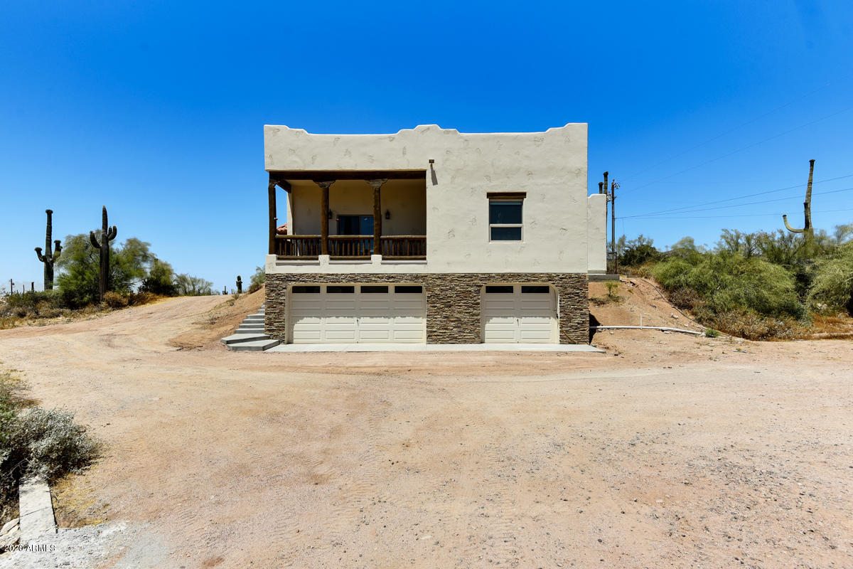 4780 North Tomahawk Road Apache Junction, AZ 85119 - Photo 6 of 42 a view of a house with a snow in the background