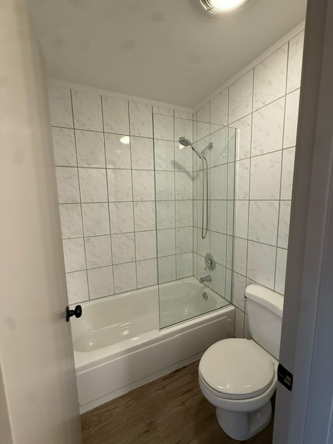 1813 Hemlock Place, Unit 311 Schaumburg, IL 60173 - Photo 11 of 17 a white toilet and tub sitting next to a bathroom sink