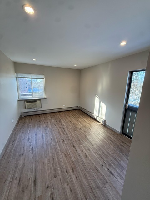 1813 Hemlock Place, Unit 311 Schaumburg, IL 60173 - Photo 13 of 17 a view of empty room with wooden floor