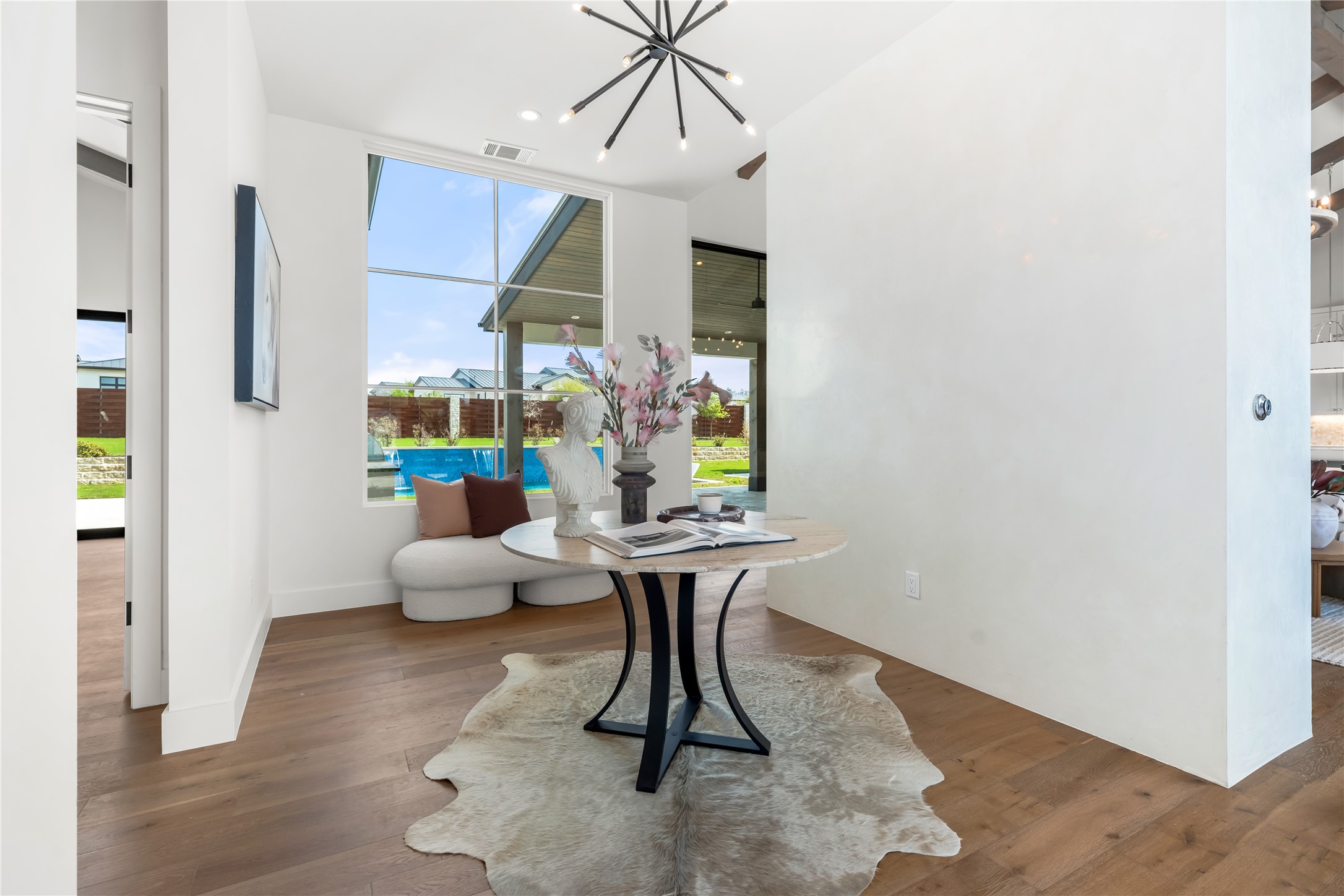 17212 Morning Grove Lane Austin, TX 78738 - Photo 3 of 38 a dining room with furniture and wooden floor