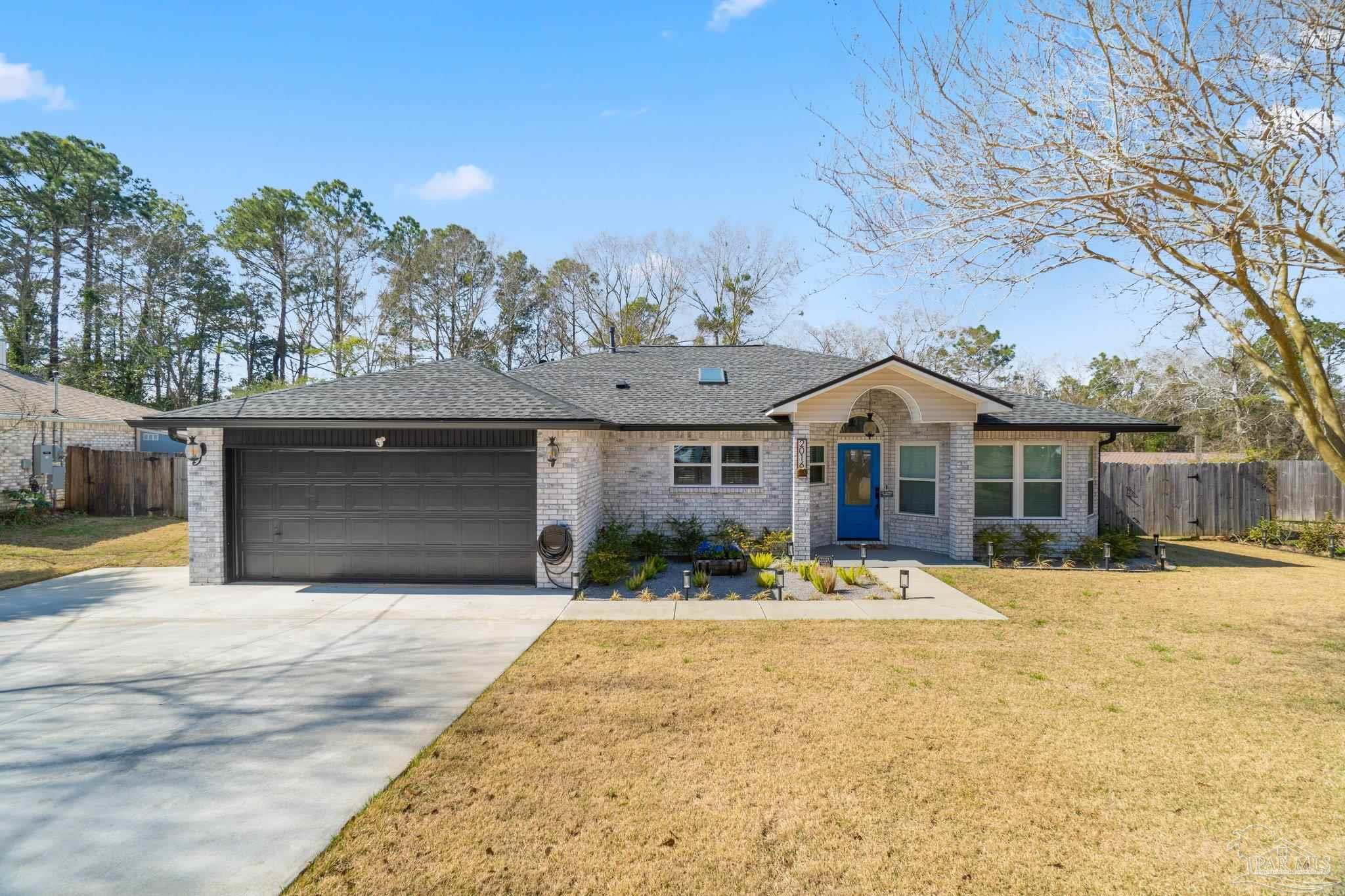 2016 Winners Circle Cantonment, FL 32533 - Photo 1 of 32 a front view of a house with a yard