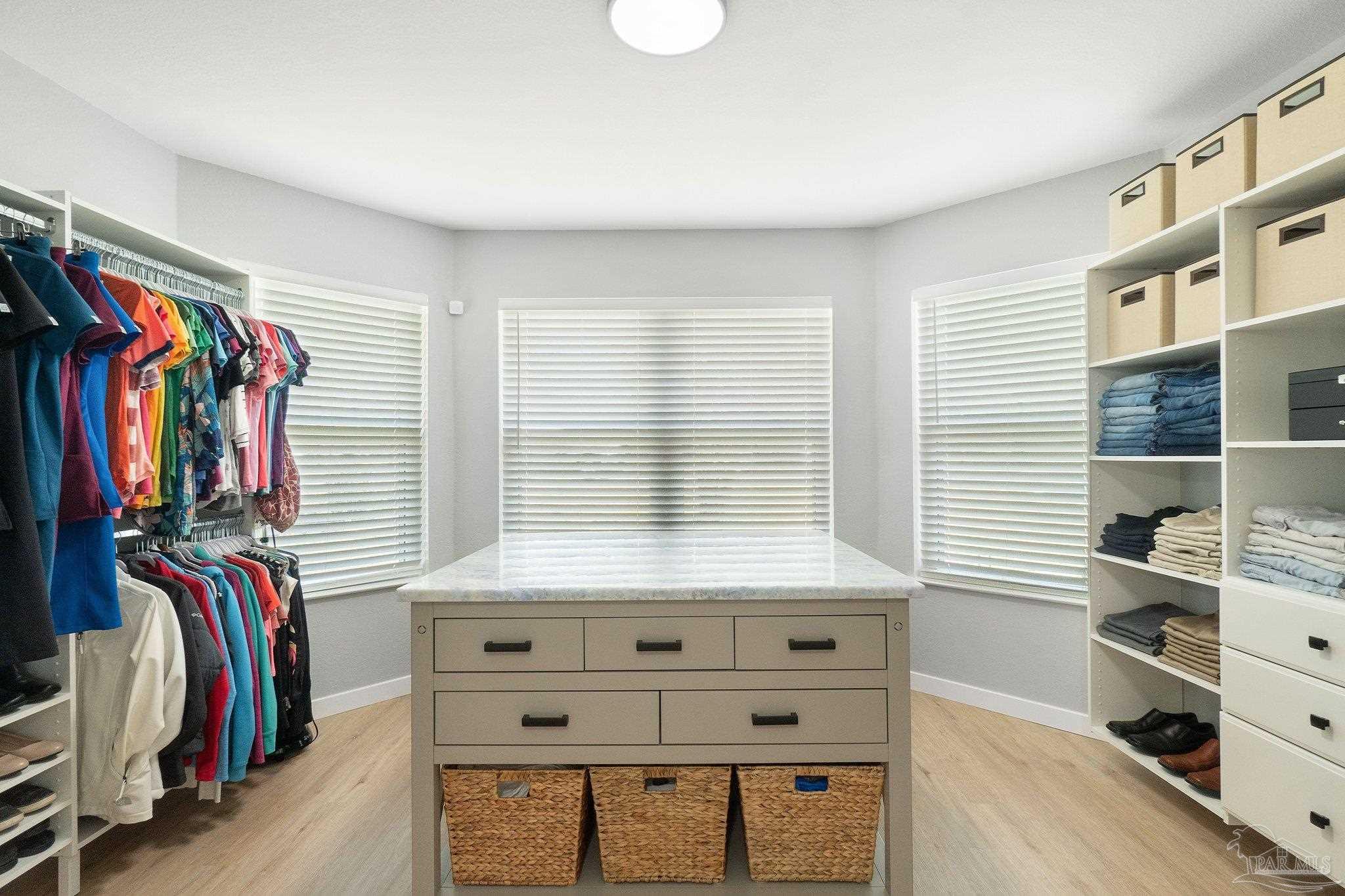 2016 Winners Circle Cantonment, FL 32533 - Photo 17 of 32 a view of walk in closet with clothes and shoes