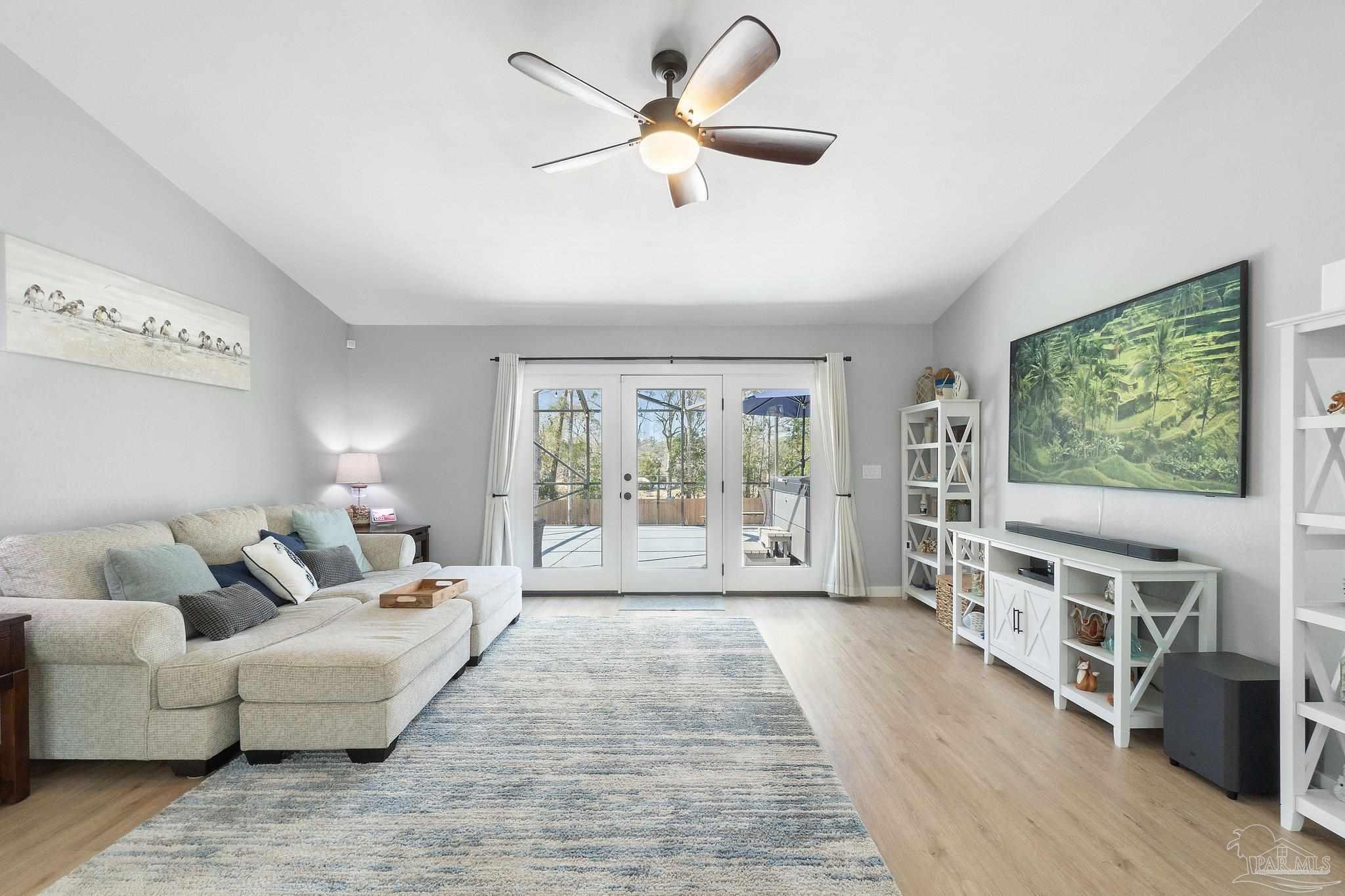 2016 Winners Circle Cantonment, FL 32533 - Photo 19 of 32 a living room with furniture and a flat screen tv