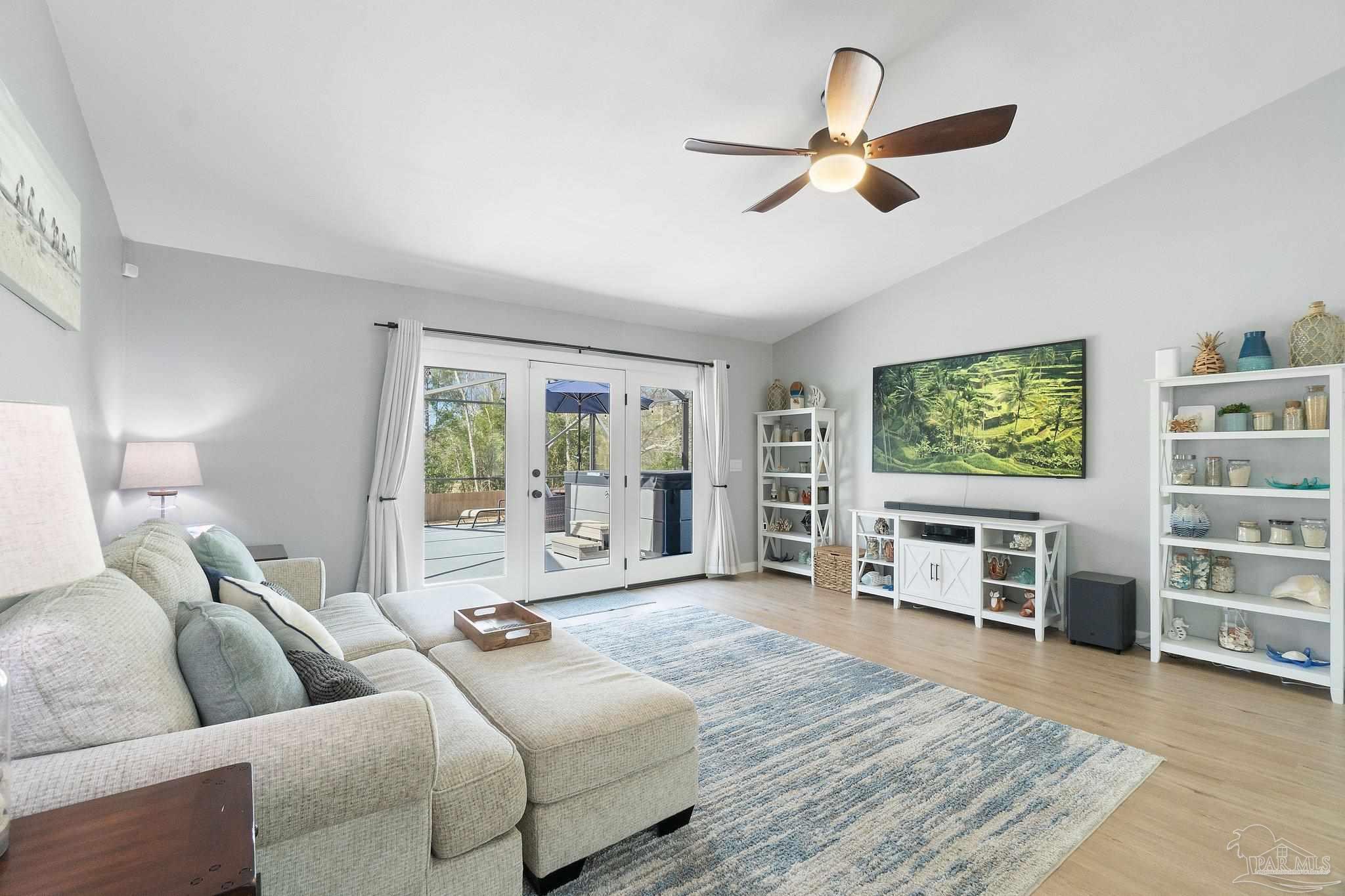 2016 Winners Circle Cantonment, FL 32533 - Photo 20 of 32 a living room with furniture and a flat screen tv
