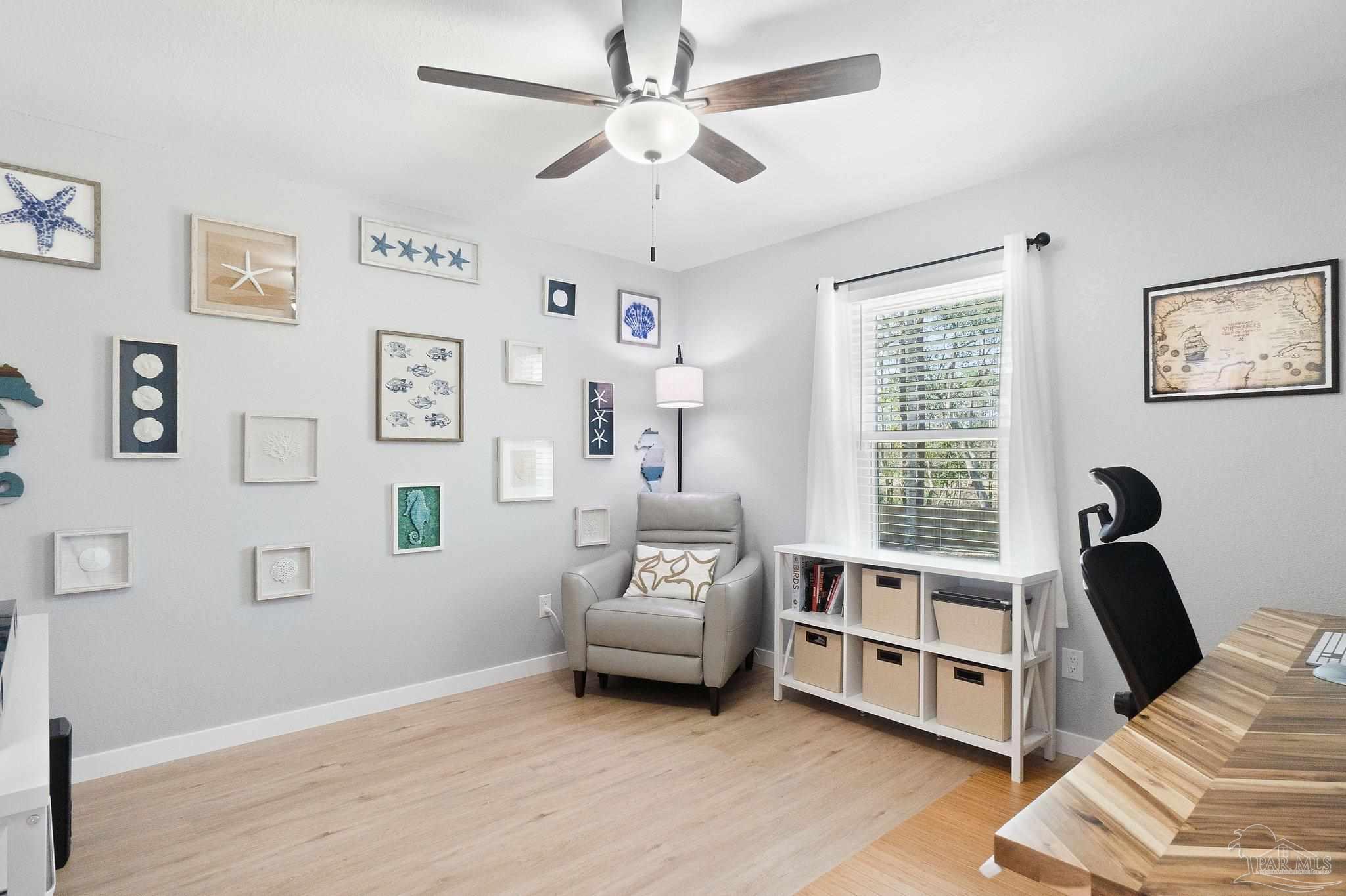 2016 Winners Circle Cantonment, FL 32533 - Photo 24 of 32 a living room with furniture and a large window