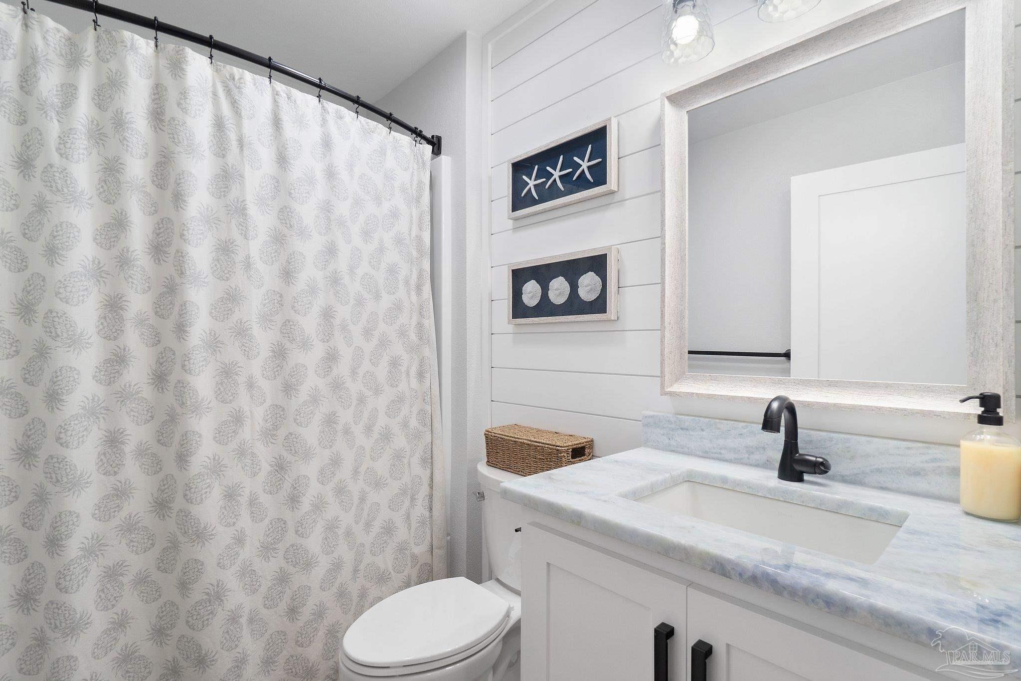 2016 Winners Circle Cantonment, FL 32533 - Photo 26 of 32 a bathroom with a sink and a toilet