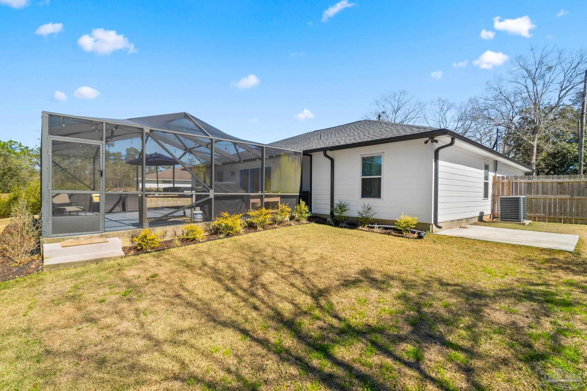 2016 Winners Circle Cantonment, FL 32533 - Photo 31 of 32 a view of a house with pool and sitting area