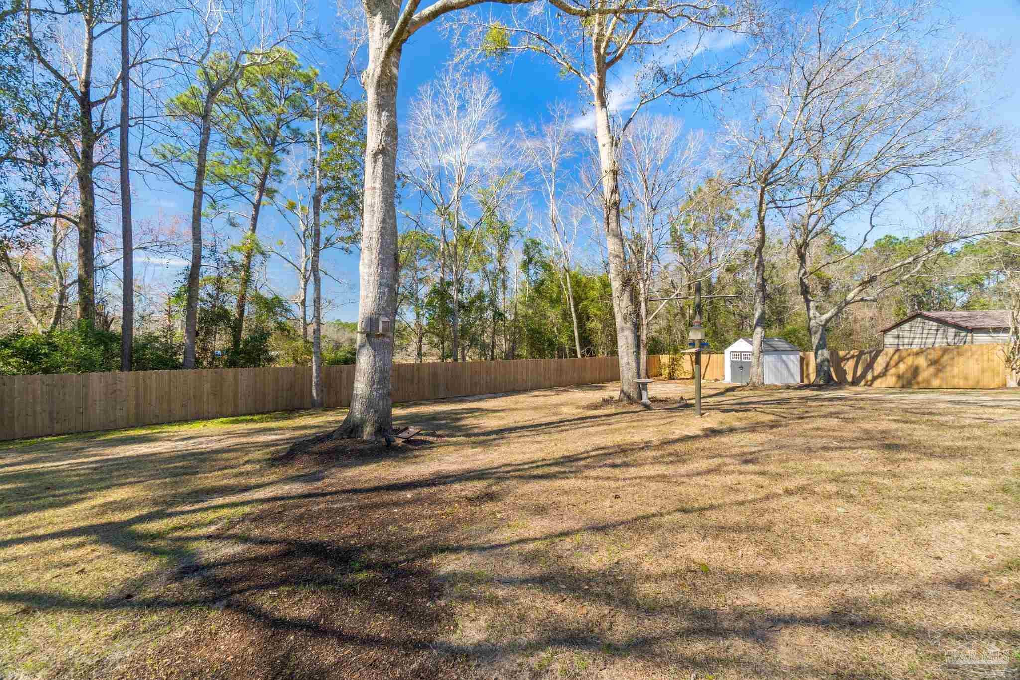 2016 Winners Circle Cantonment, FL 32533 - Photo 32 of 32 a view of yard with trees