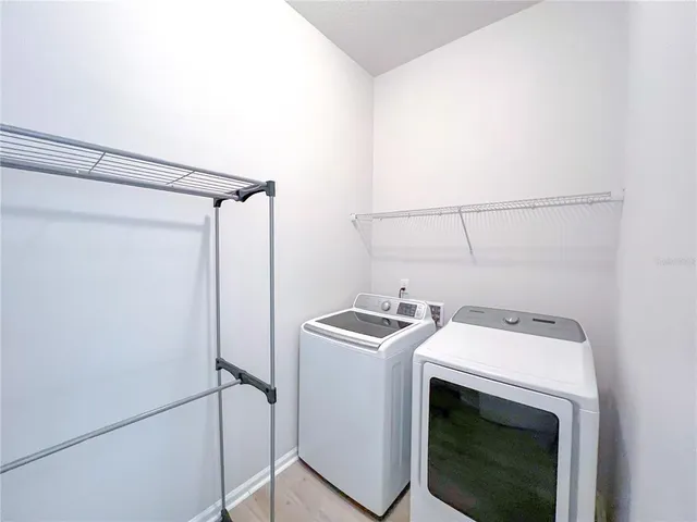 a utility room with dryer and washer