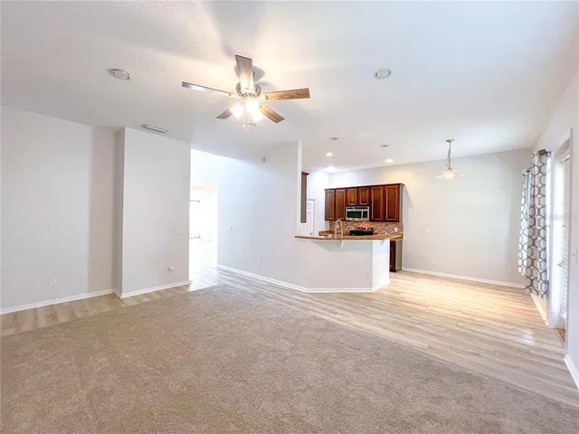 a view of a kitchen with a sink and a window