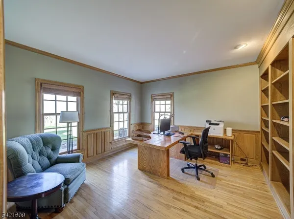a view of a livingroom with workspace and a couch