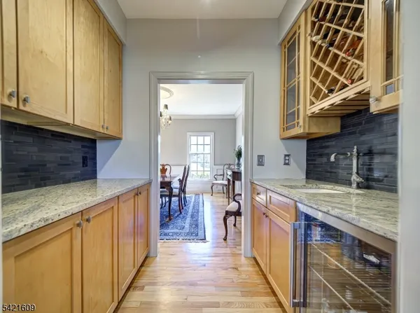 a kitchen with stainless steel appliances granite countertop a stove and cabinets