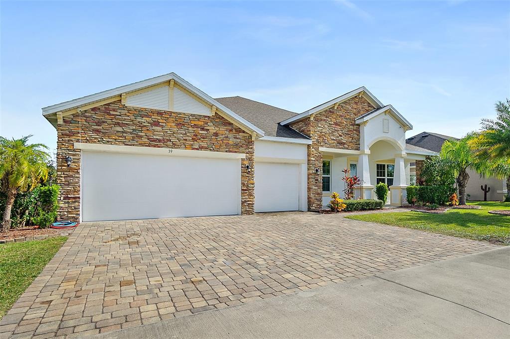 39 Turtle Ridge Drive Flagler Beach, FL 32136 - Photo 15 of 58 a view of a house with a yard and large tree