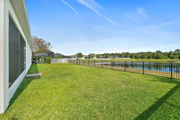 a view of outdoor space with swimming pool and green space