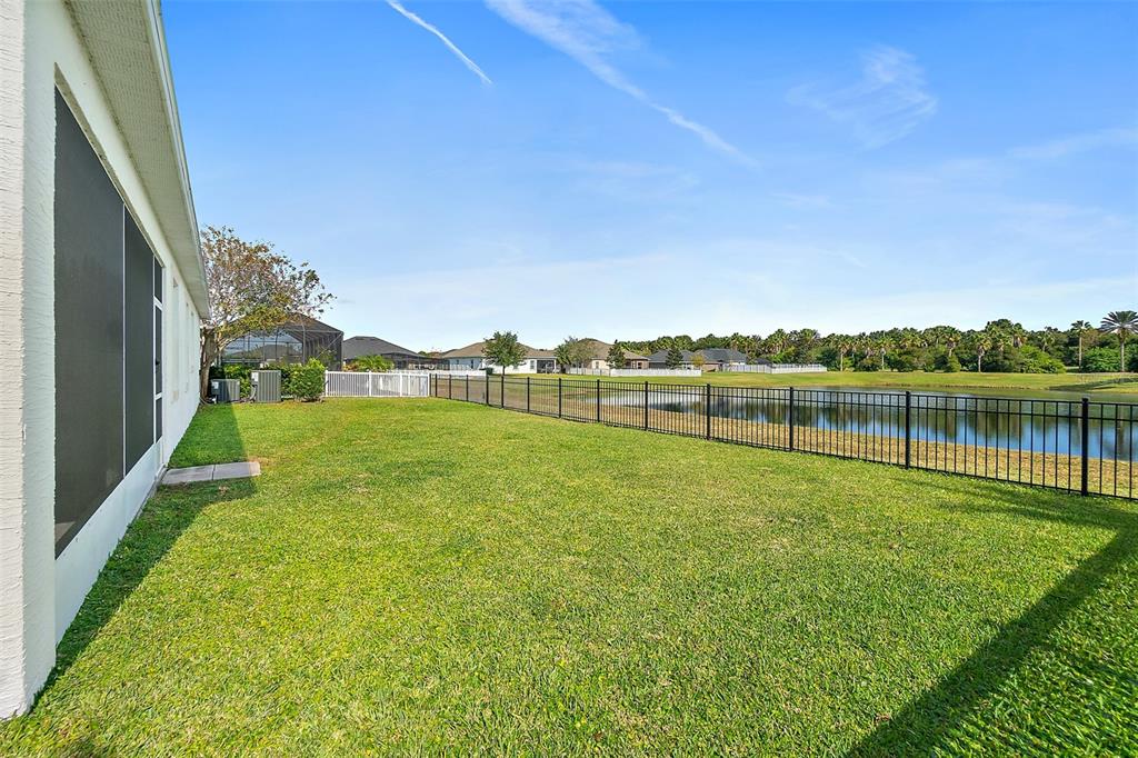 39 Turtle Ridge Drive Flagler Beach, FL 32136 - Photo 16 of 58 a view of a lake with houses in the background