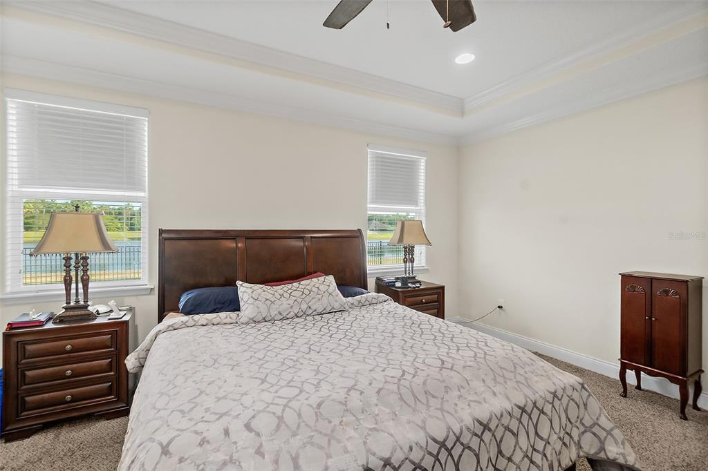 39 Turtle Ridge Drive Flagler Beach, FL 32136 - Photo 19 of 58 a bedroom with a bed and wooden floor