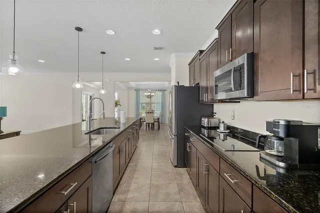 a view of a kitchen with furniture and a window