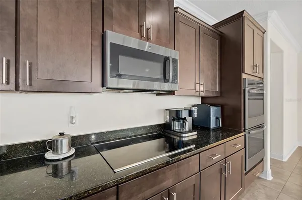 a bathroom with a double vanity sink a mirror and shower