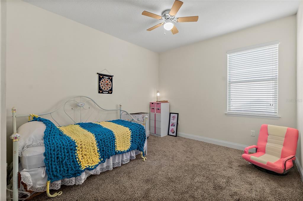 39 Turtle Ridge Drive Flagler Beach, FL 32136 - Photo 28 of 58 a bedroom with a bed and window