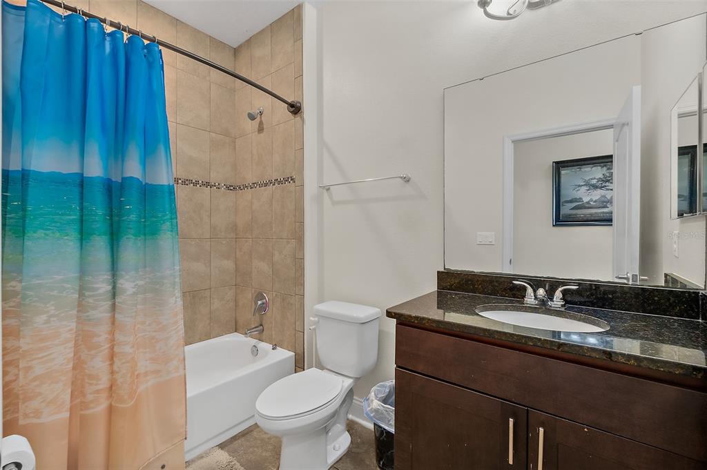 39 Turtle Ridge Drive Flagler Beach, FL 32136 - Photo 29 of 58 a bathroom with a granite countertop sink toilet and shower