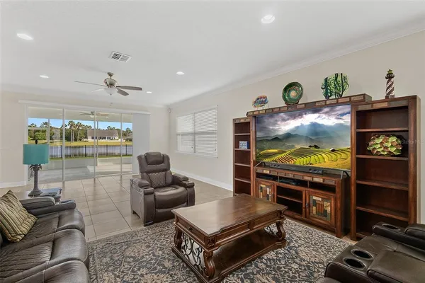 a kitchen with stainless steel appliances granite countertop a refrigerator a sink and a stove