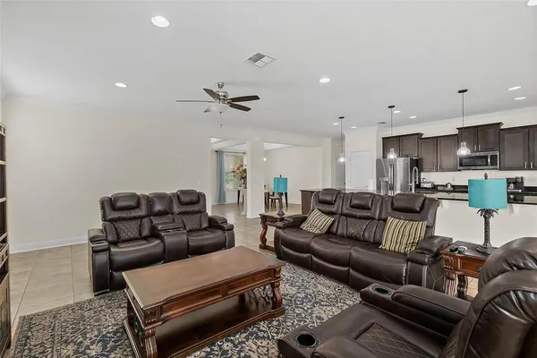 a dining room with furniture and a chandelier