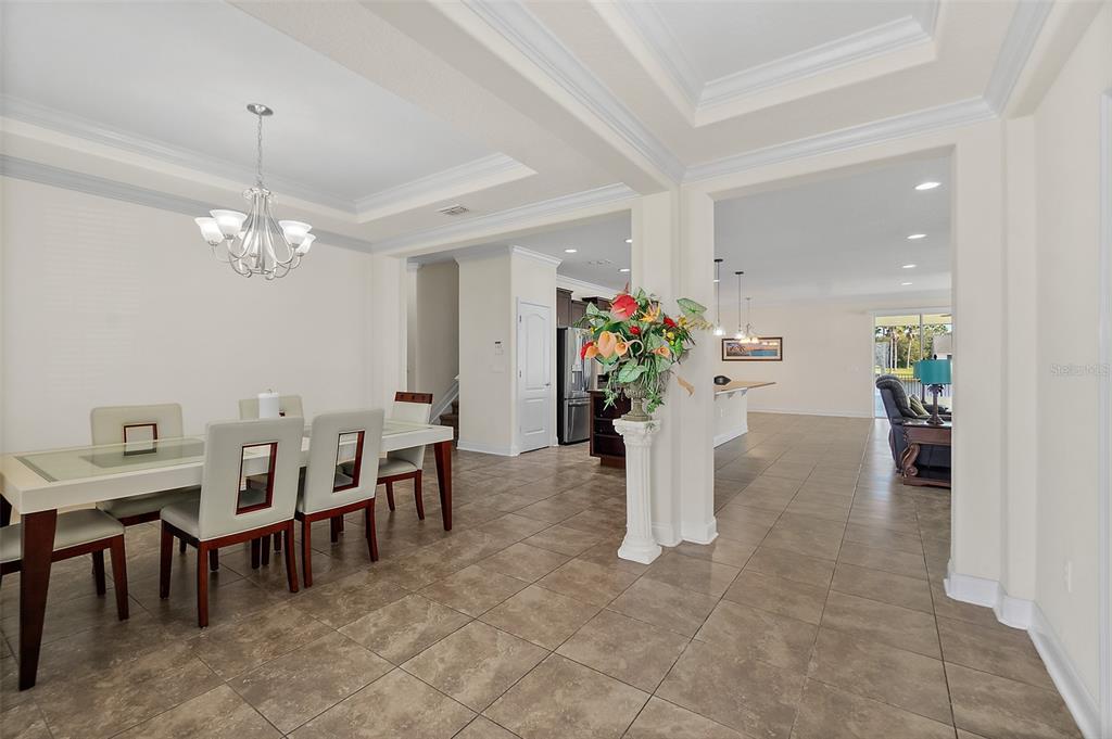 39 Turtle Ridge Drive Flagler Beach, FL 32136 - Photo 48 of 58 a dining room with furniture and a chandelier