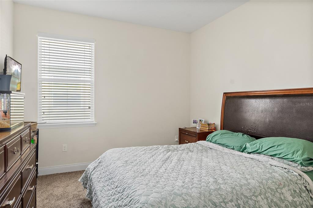 39 Turtle Ridge Drive Flagler Beach, FL 32136 - Photo 50 of 58 a bedroom with a bed and a window