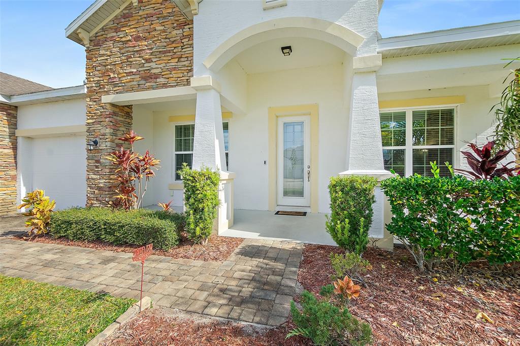 39 Turtle Ridge Drive Flagler Beach, FL 32136 - Photo 5 of 58 a front view of a house with a yard