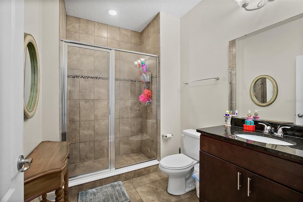39 Turtle Ridge Drive Flagler Beach, FL 32136 - Photo 52 of 58 a bathroom with a sink vanity mirror and toilet