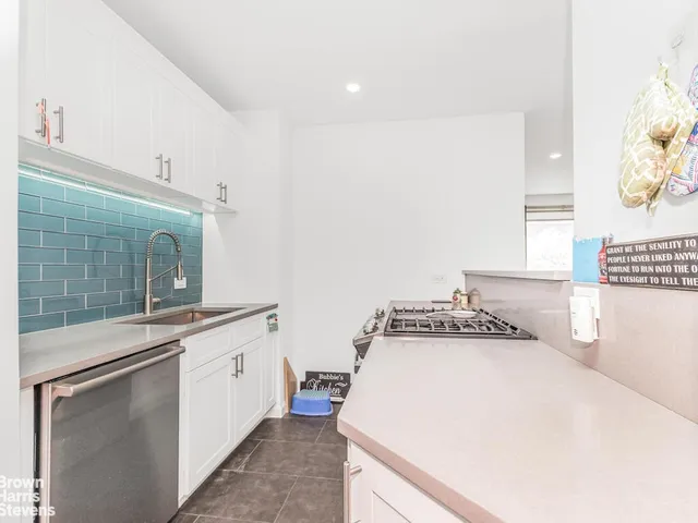 a kitchen with a stove and a sink