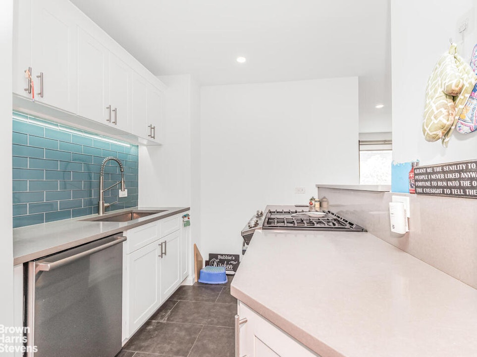 3777 Independence Avenue, Unit 4D Bronx, NY 10463 - Photo 10 of 29 a kitchen with a stove and a sink