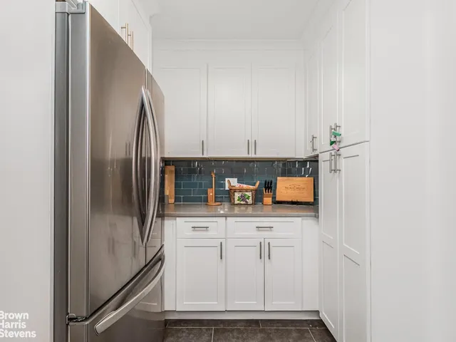 a kitchen with stainless steel appliances a refrigerator and a sink