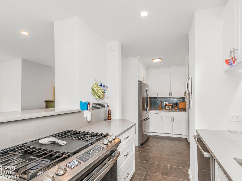 3777 Independence Avenue, Unit 4D Bronx, NY 10463 - Photo 13 of 29 a kitchen with a stove and a refrigerator