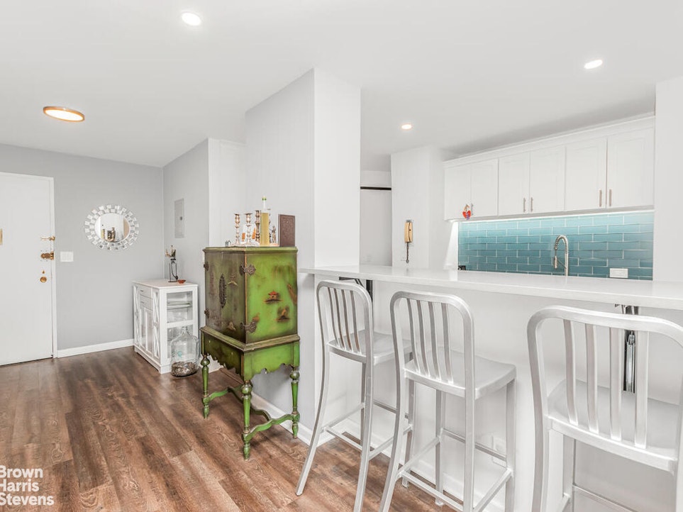 3777 Independence Avenue, Unit 4D Bronx, NY 10463 - Photo 15 of 29 a kitchen with furniture a refrigerator and wooden floor