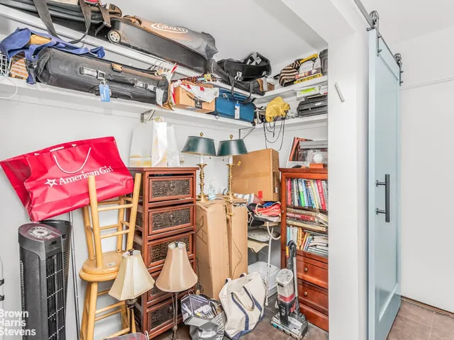 a utility room with cabinets dryer and washer