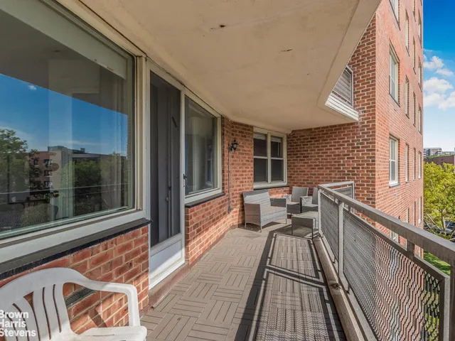 a view of balcony with furniture
