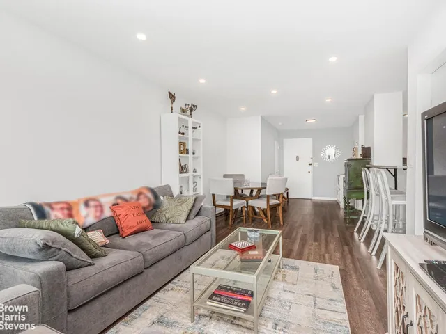 a lobby with furniture and floor to ceiling window