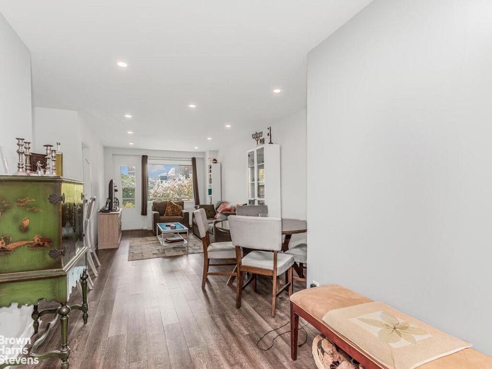 3777 Independence Avenue, Unit 4D Bronx, NY 10463 - Photo 4 of 29 a living room with furniture and a flat screen tv