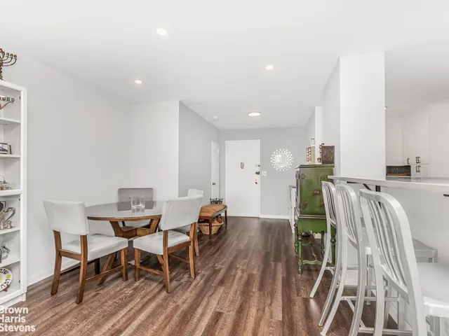 a workspace with furniture and wooden floor