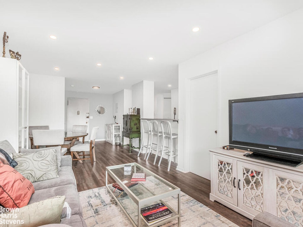3777 Independence Avenue, Unit 4D Bronx, NY 10463 - Photo 6 of 29 a living room with furniture and a flat screen tv