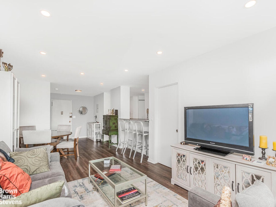 3777 Independence Avenue, Unit 4D Bronx, NY 10463 - Photo 7 of 29 a living room with furniture and a flat screen tv