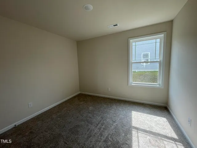 a bathroom with a granite countertop sink a mirror and a bathtub