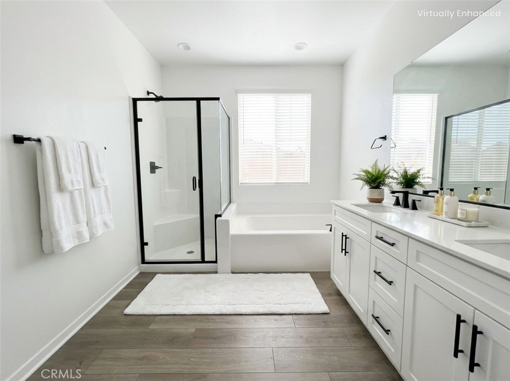 16596 Strategy Place Chino, CA 91708 - Photo 7 of 10 a bathroom with a tub sink and mirror