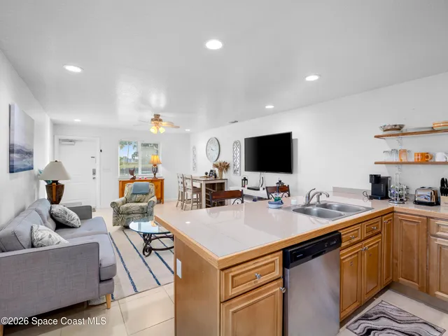 a bedroom with a bed and a dresser in it