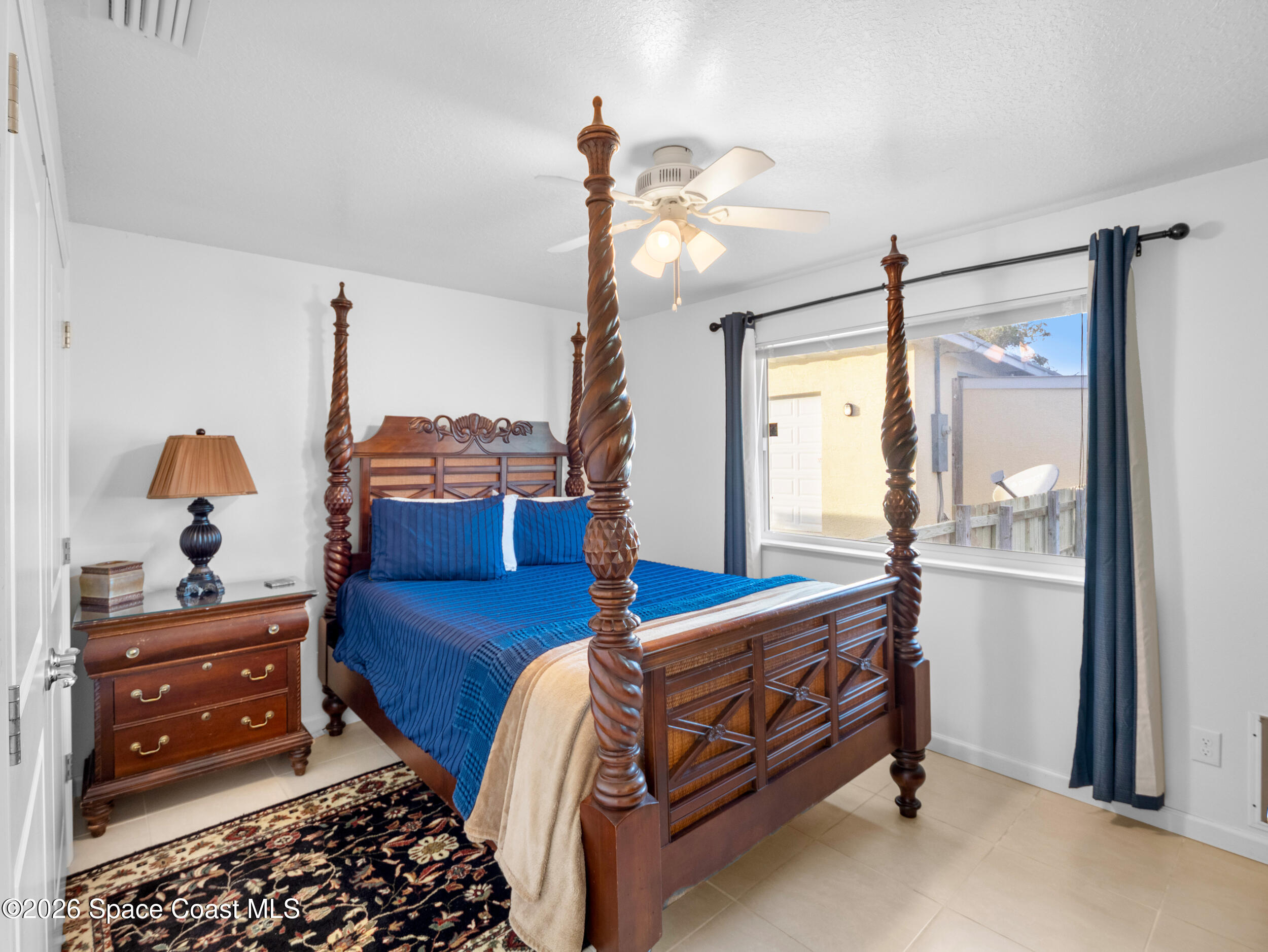 222 Rosa L Jones Drive Cocoa, FL 32922 - Photo 18 of 36 a bedroom with a bed and a dresser in it