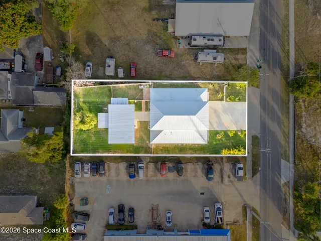 an aerial view of houses with outdoor space