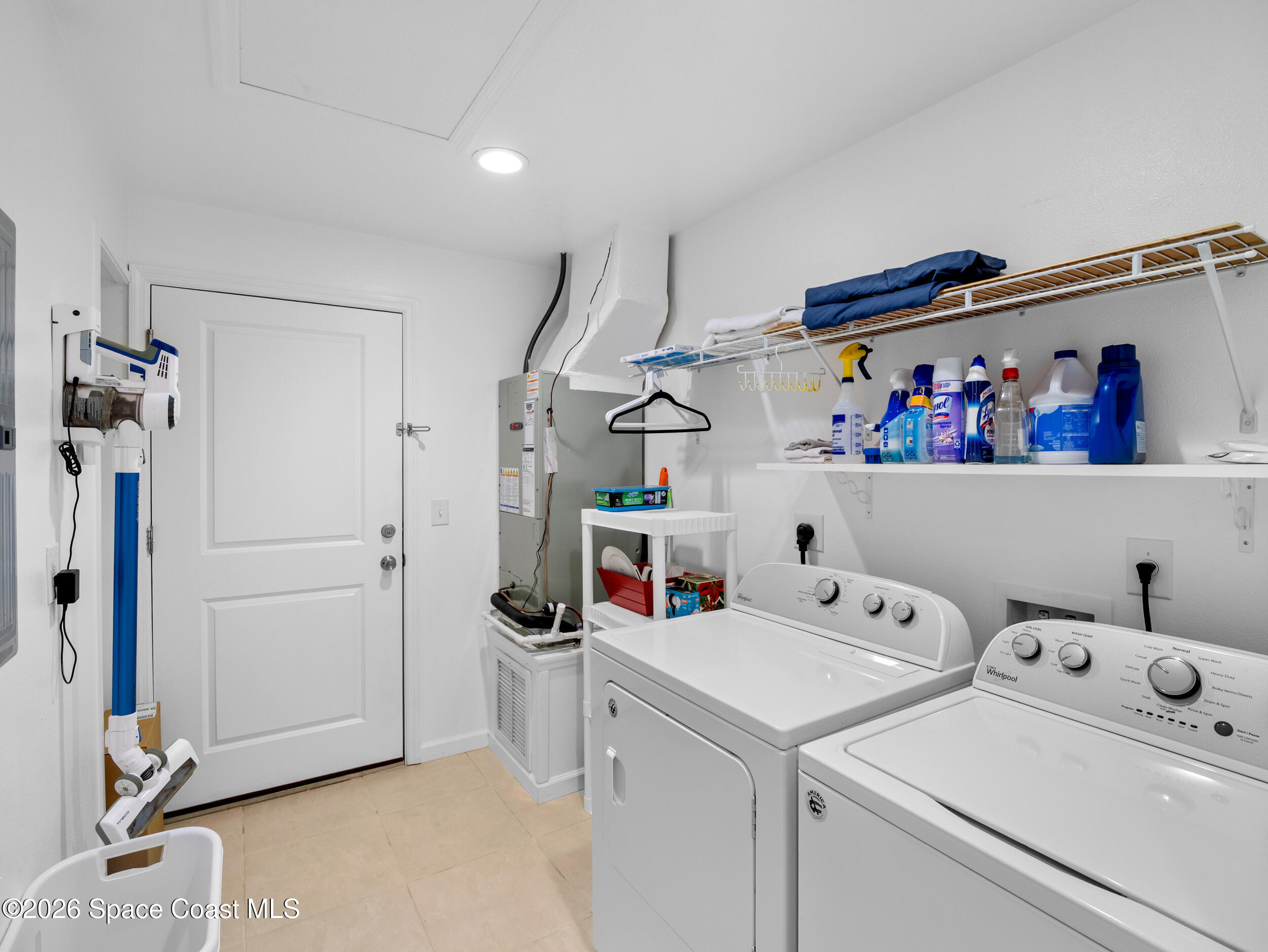 222 Rosa L Jones Drive Cocoa, FL 32922 - Photo 20 of 36 a storage room with washer and dryer
