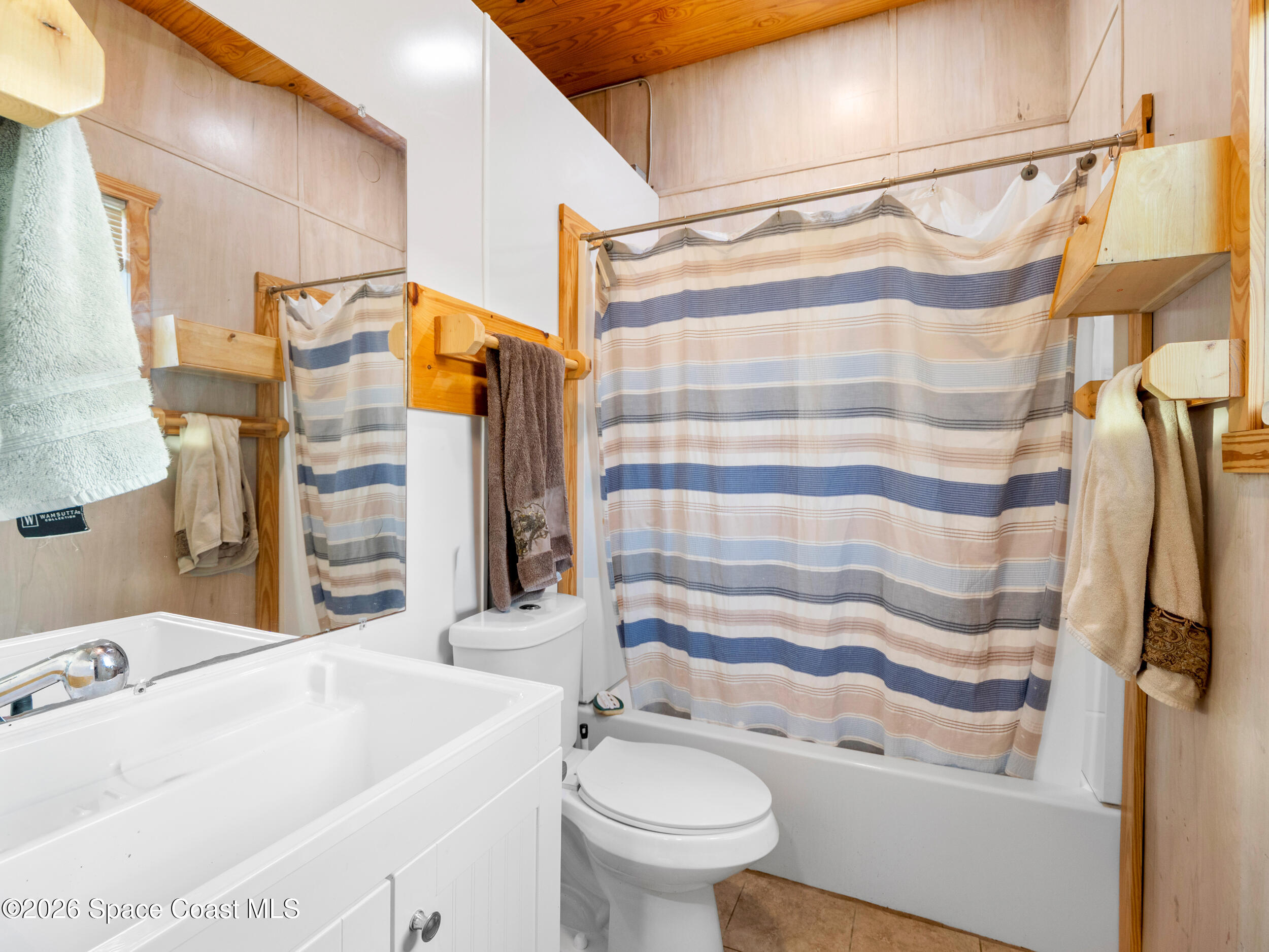 222 Rosa L Jones Drive Cocoa, FL 32922 - Photo 24 of 36 a bathroom with a sink and toilet